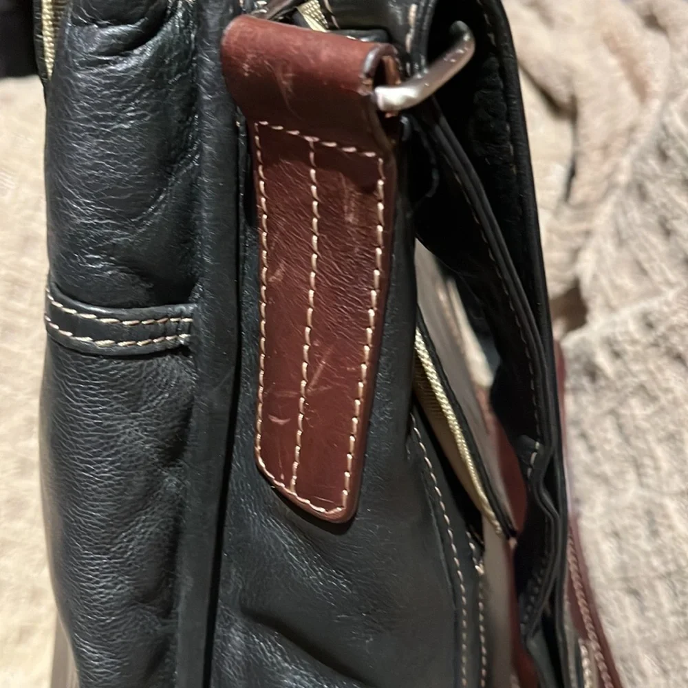 The territory ahead, black with brown leather trim, laptop bag